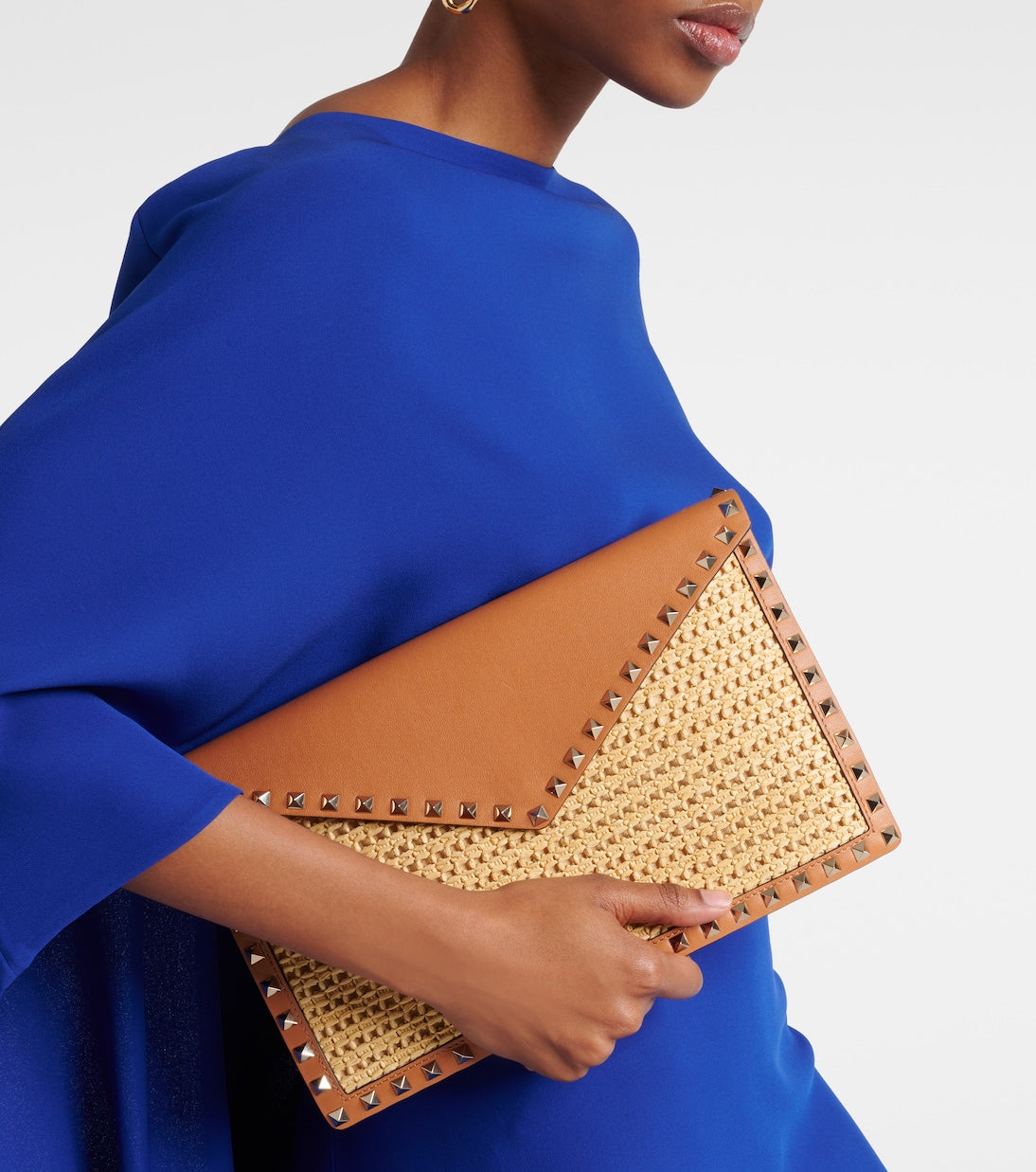 Valentino Garavani - Rockstud Large leather-trimmed raffia clutch