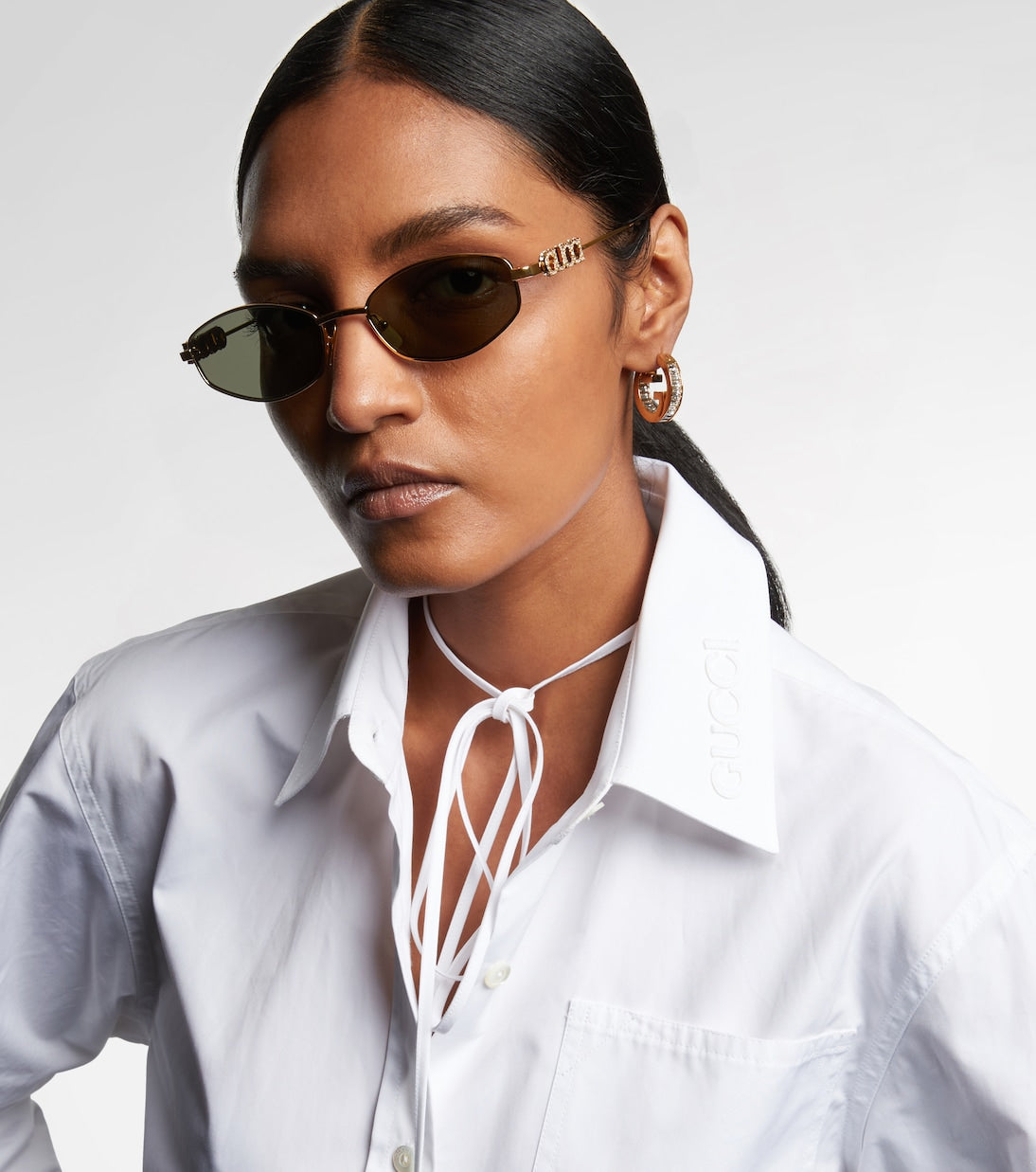 Gucci - Logo embellished oval sunglasses