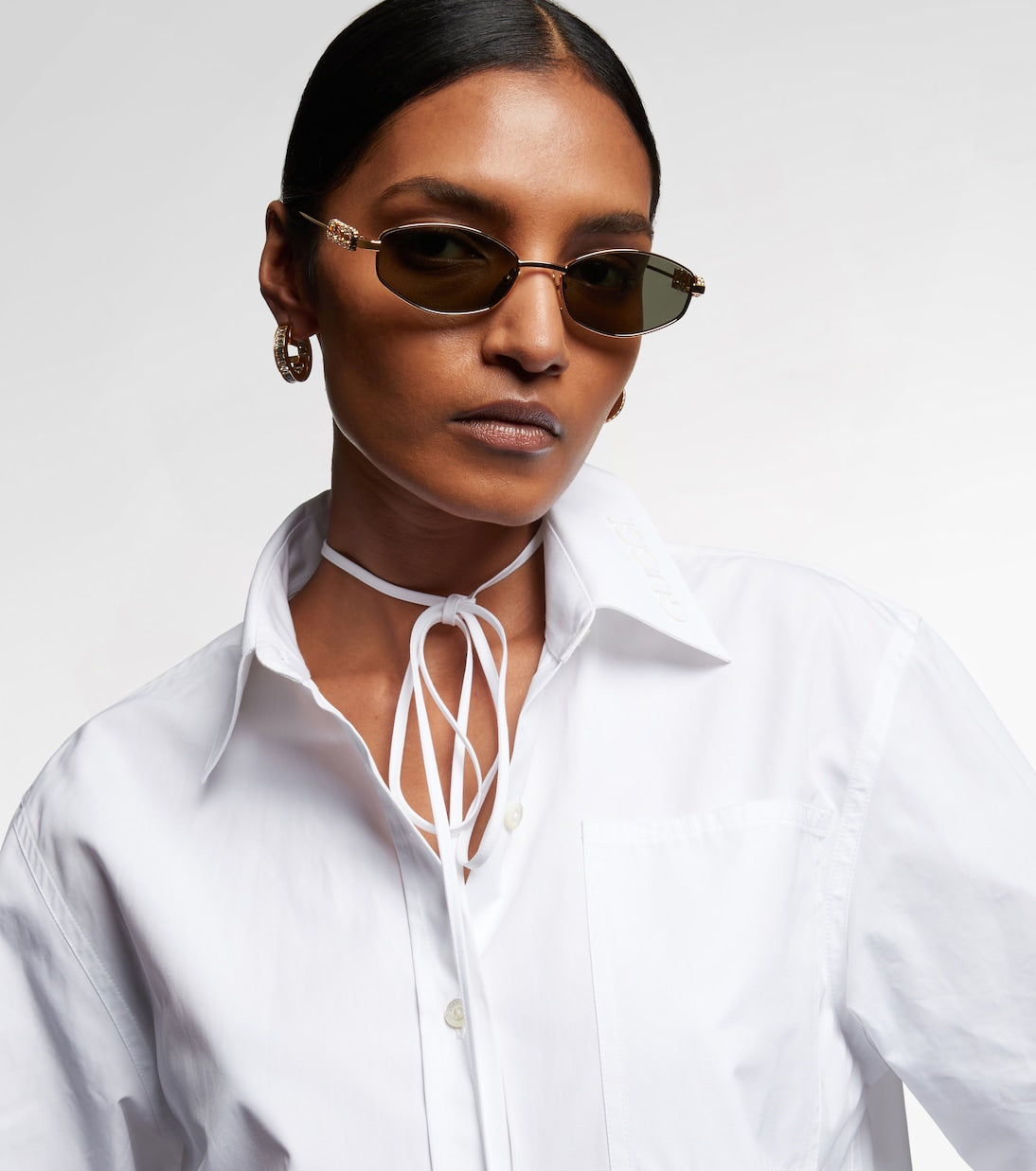 Gucci - Logo embellished oval sunglasses