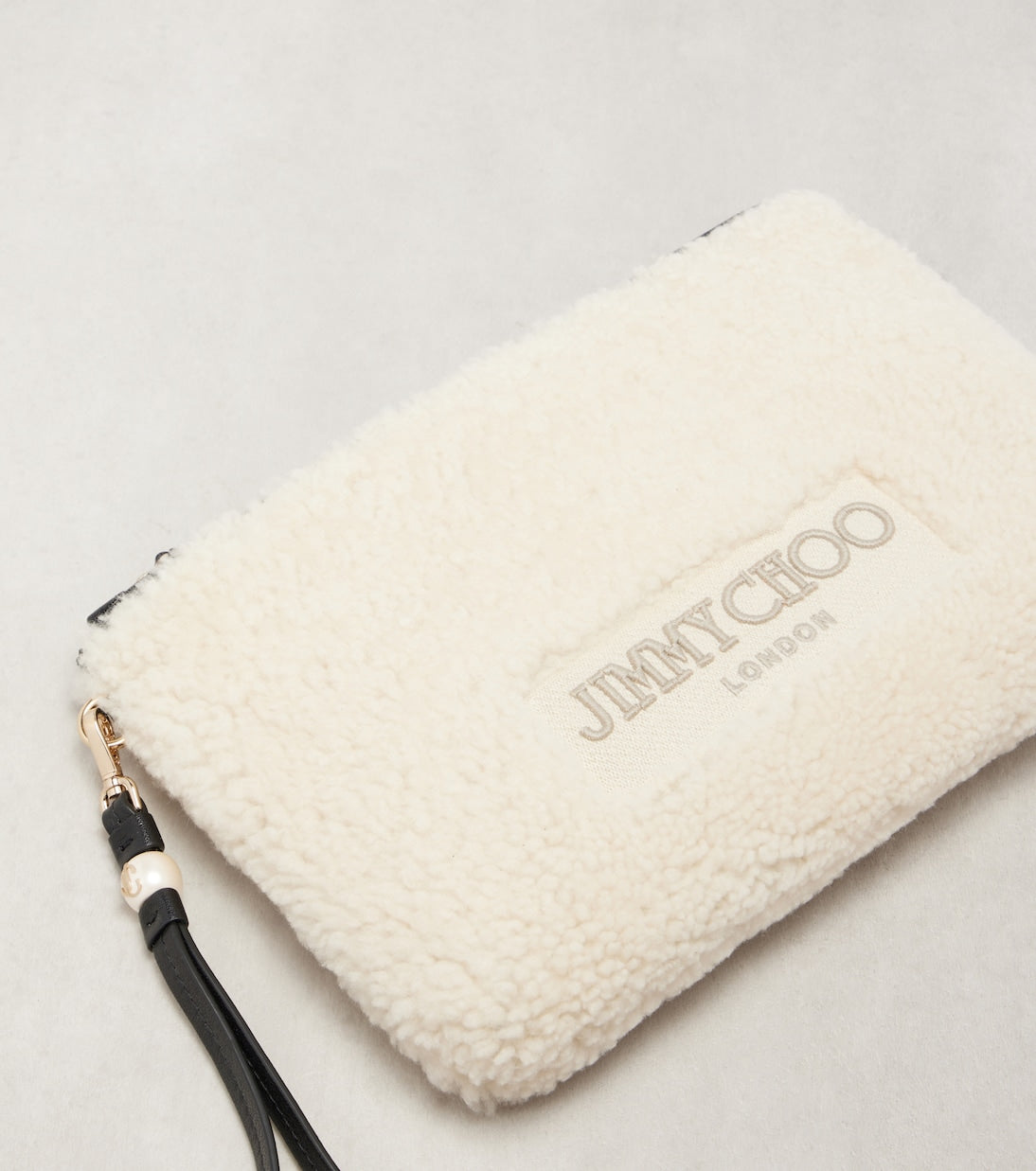 Jimmy Choo - Logo shearling pouch with strap