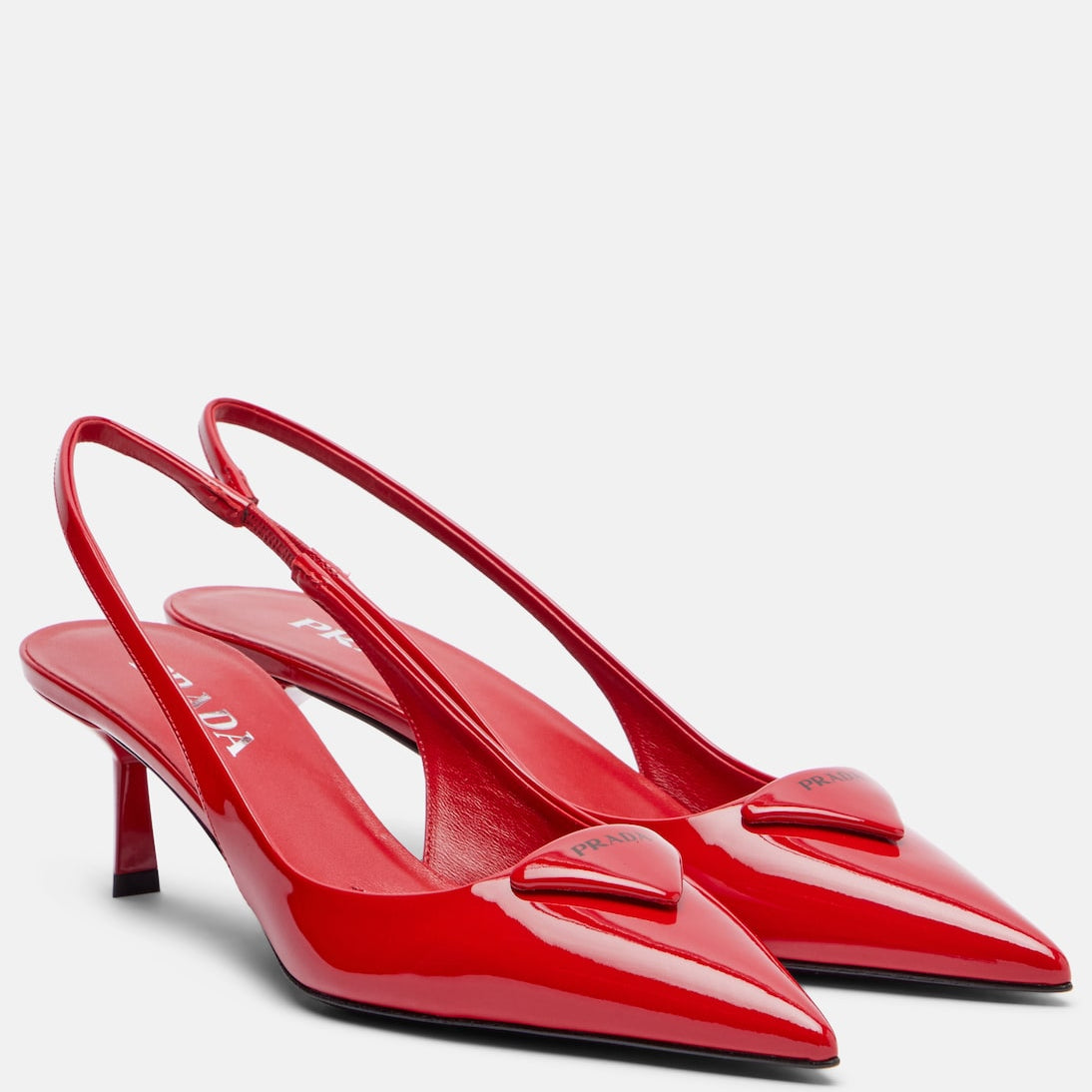 Prada - 55 patent leather slingback pumps