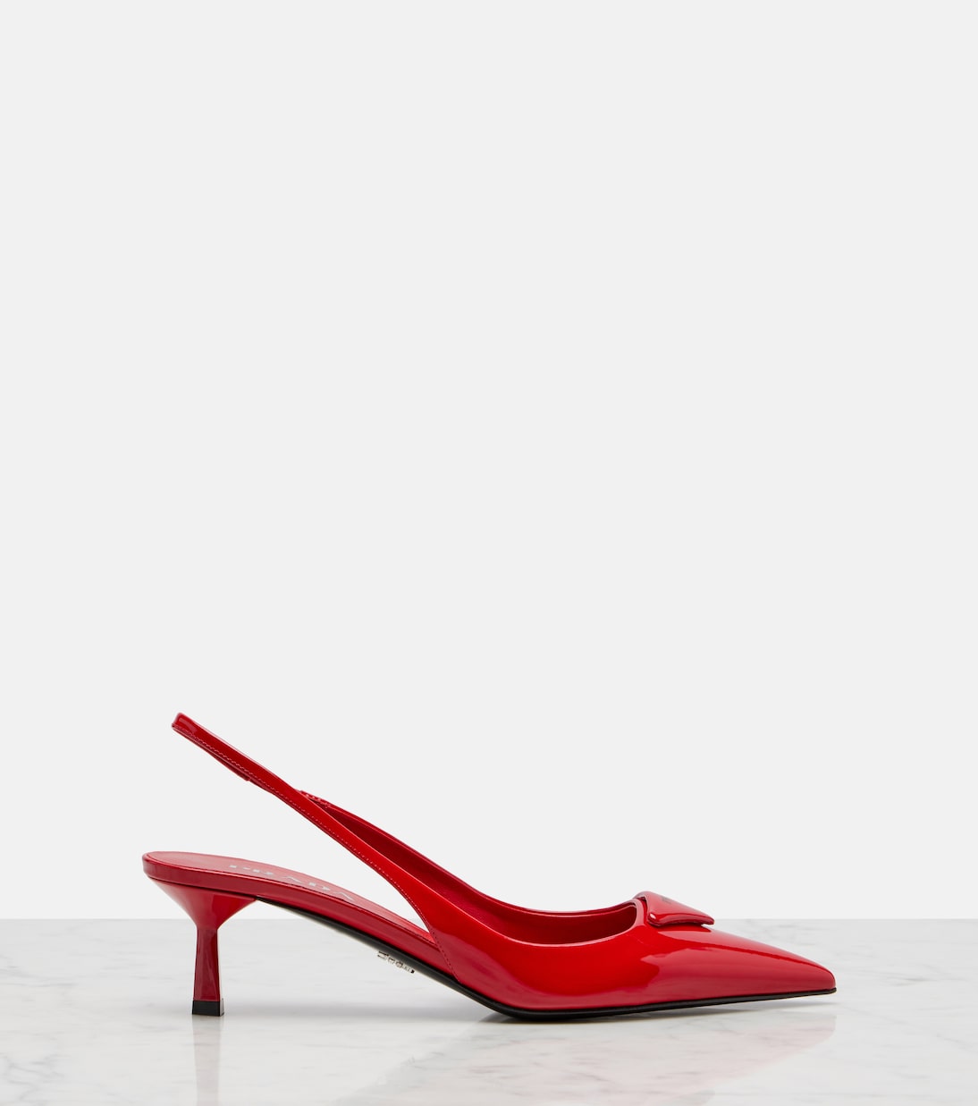 Prada - 55 patent leather slingback pumps