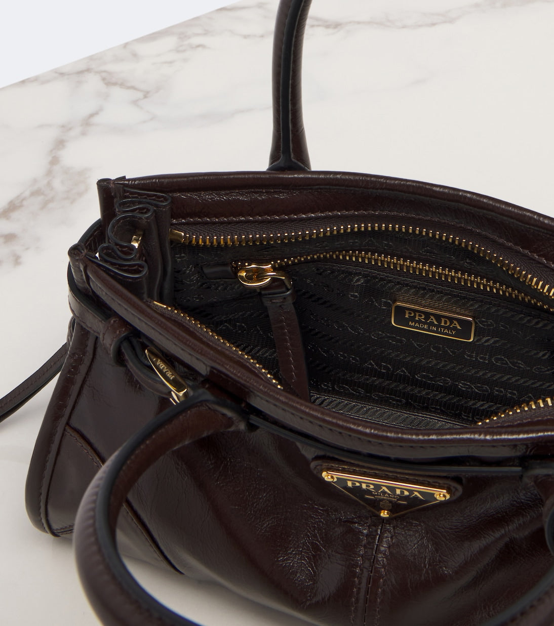 Prada - Prada Bonnie Mini leather top-handle bag
