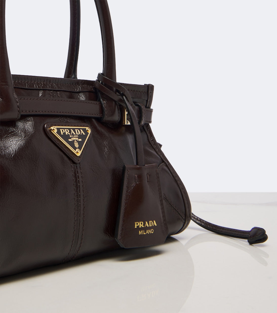 Prada - Prada Bonnie Mini leather top-handle bag